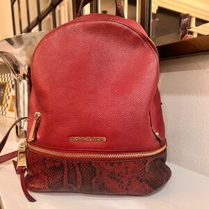 Michael Kors Burgundy and Snake Print Leather Backpack with gold hardware